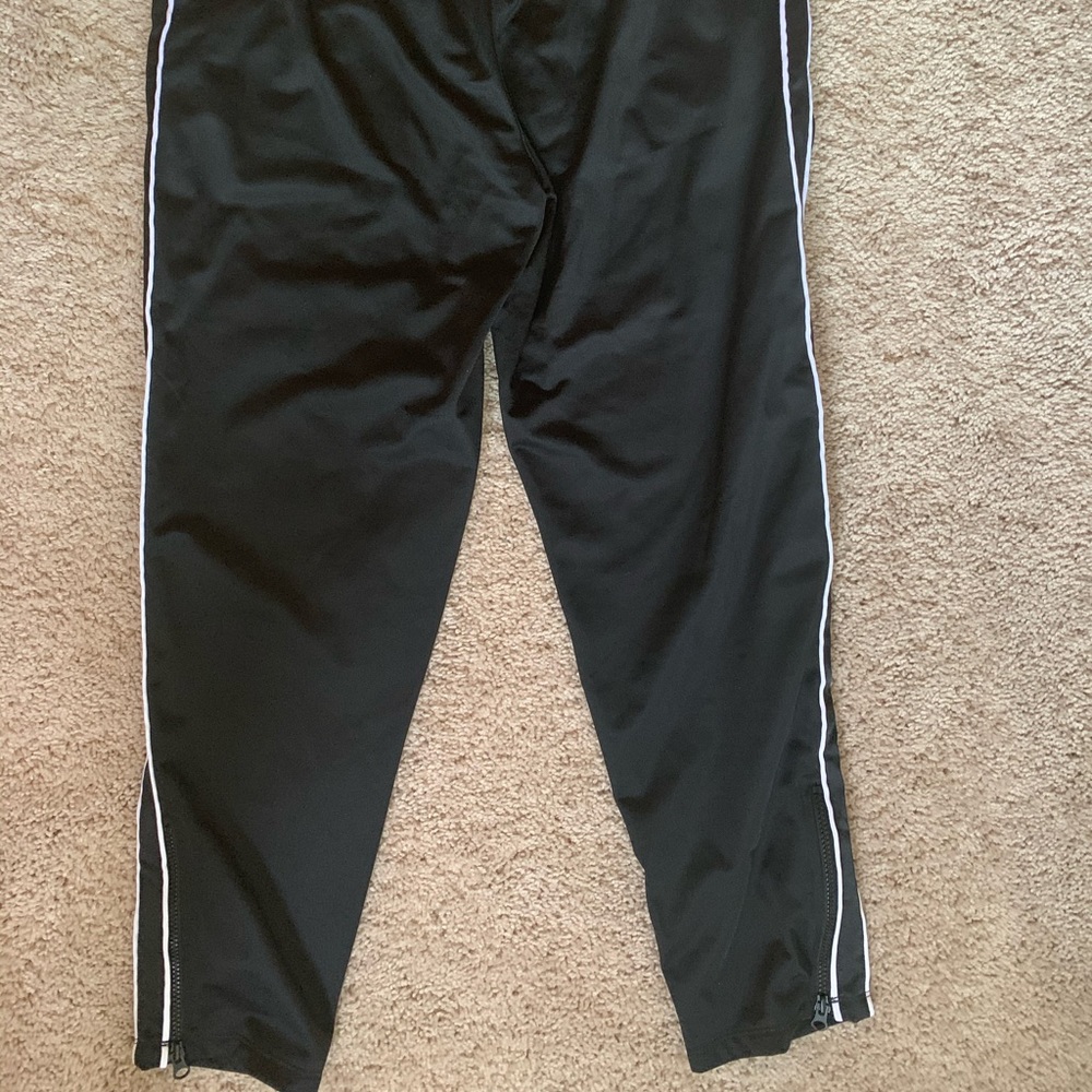 Champions jogging pants, zip up in the sides